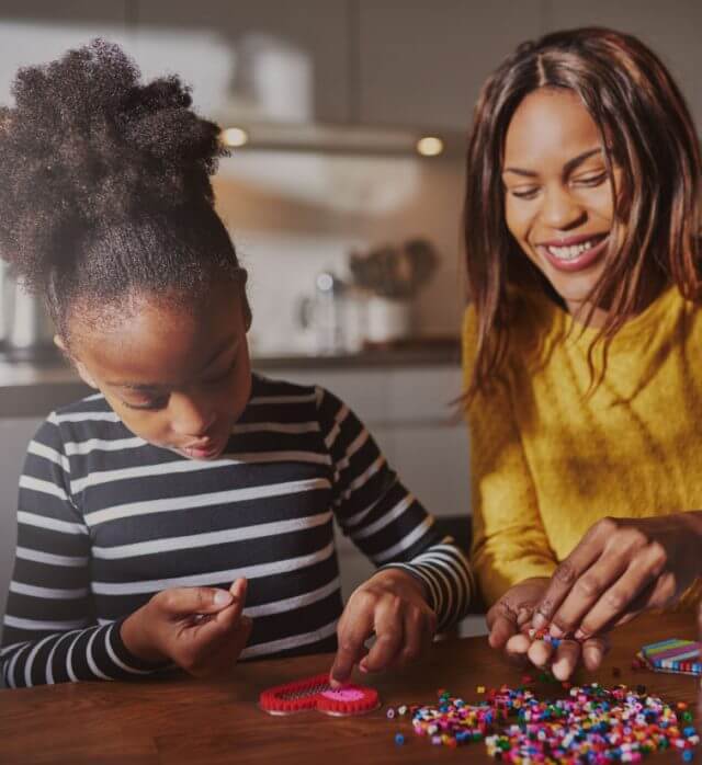 A woam and a girl enjoy crafting in their new kitchen